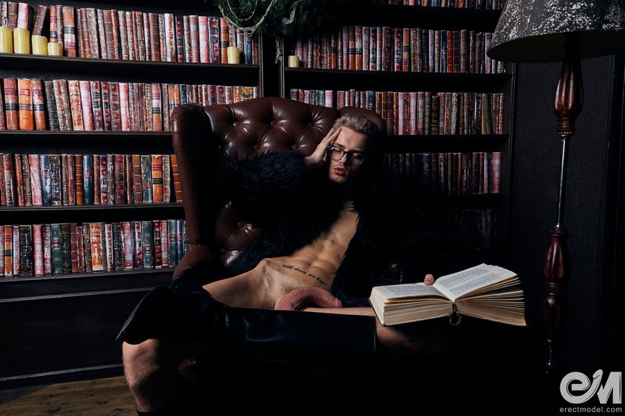 Playing with big dick while gay porn reading