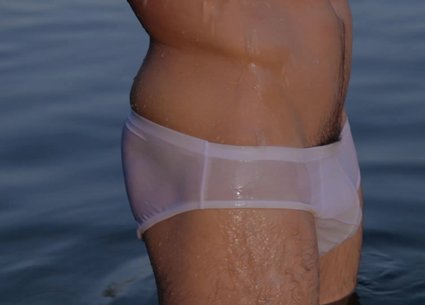 Sexy man bathing in gay white underwear