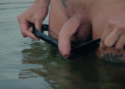Wet uncut thick cock bathing in the water